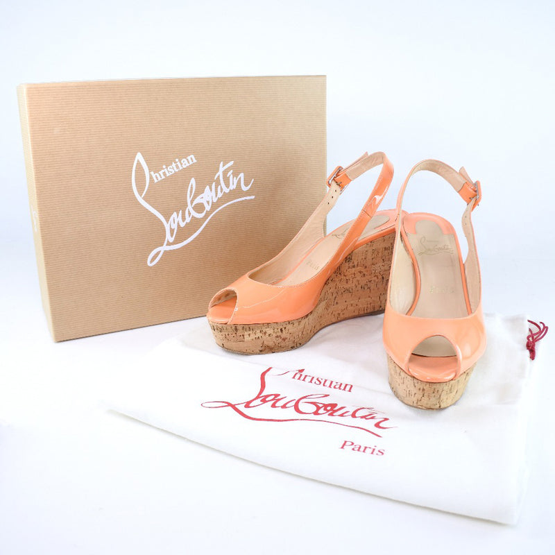 [Christian Louboutin] Christian Lubutan 
 Sandalias de cuña 
 Naranja de cuero de patente 37 Damas de cuña grabada