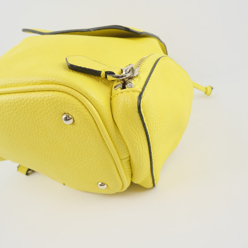 [Supongo] Adivina 
 Mochila de Luc 
 Cuero amarillo unisex un rango