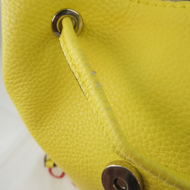 [Supongo] Adivina 
 Mochila de Luc 
 Cuero amarillo unisex un rango