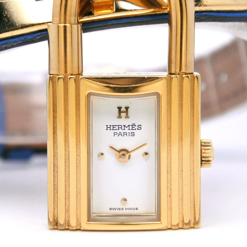 [爱马仕]爱马仕 
 凯利手表 
 729333金色镀金x皮革蓝色/金色支架〇雕刻石英模拟显示白色拨号凯利手表女士