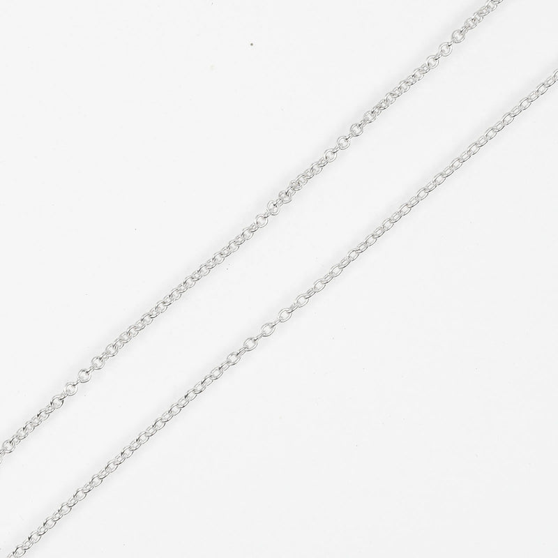 [Tiffany & co.] Tiffany 
 Collier croisé de signature 
 Argent 925 x k18 or jaune d'environ 7,2 g de croix signature dames un rang