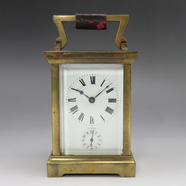 Reloj de mesa antiguo con forma de carruaje francés