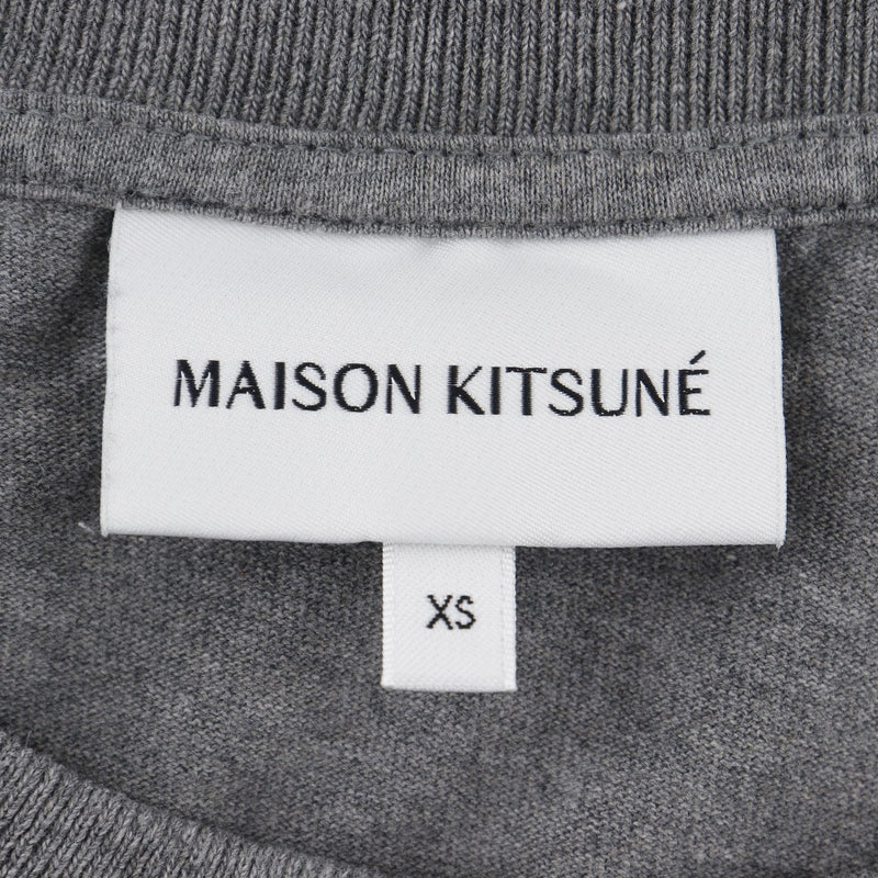 【MAISON KITSUNE】メゾンキツネ ヘッド 半袖Ｔシャツ
 MM00127KJ0118