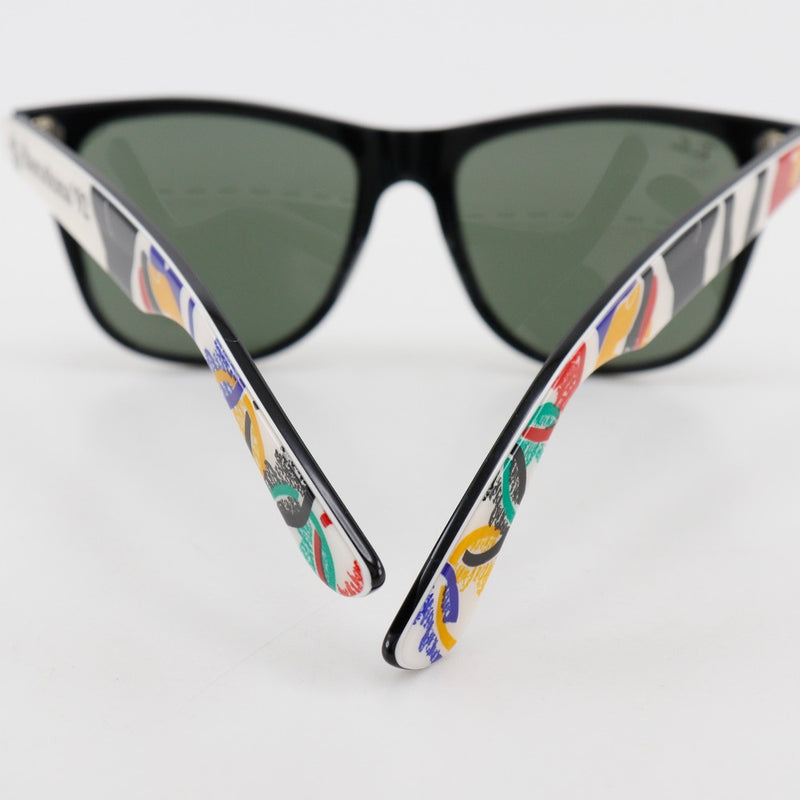 [Ray-Ban] Ray-Ban 
 Olimpiadas de Barcelona 1992 Gafas de sol 
 Sports Wayfarer 2 molestia PlatStick Black/Multicolor Barcelona Olimpics 1992 Unisex